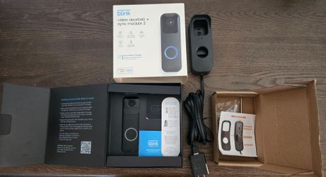 Blink video doorbell camera and charging adapter