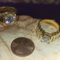 His/Hers Faux Diamond Rings. Ladies Is Approximately Size 6. Men's Approximately Size 9. Great Condition.  Goldtone.