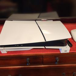 Ps5 Slim disk edition with 2 controllers, 1tb ssd storage, cooling fans.