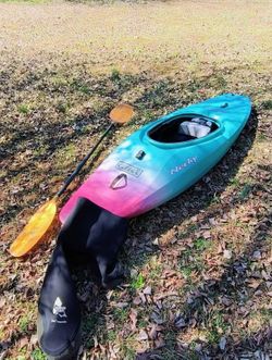 Kayak with skirt and paddle