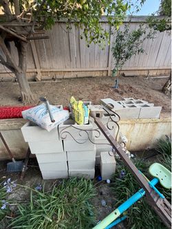Approximately 30 cinderblocks and compound material