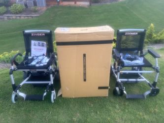 Two battery powered electric wheelchairs. Zinger and Zoomer