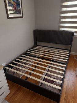 Upholstered bed with storage. Gray, Queen size. Very good condition. Mattress is not included.