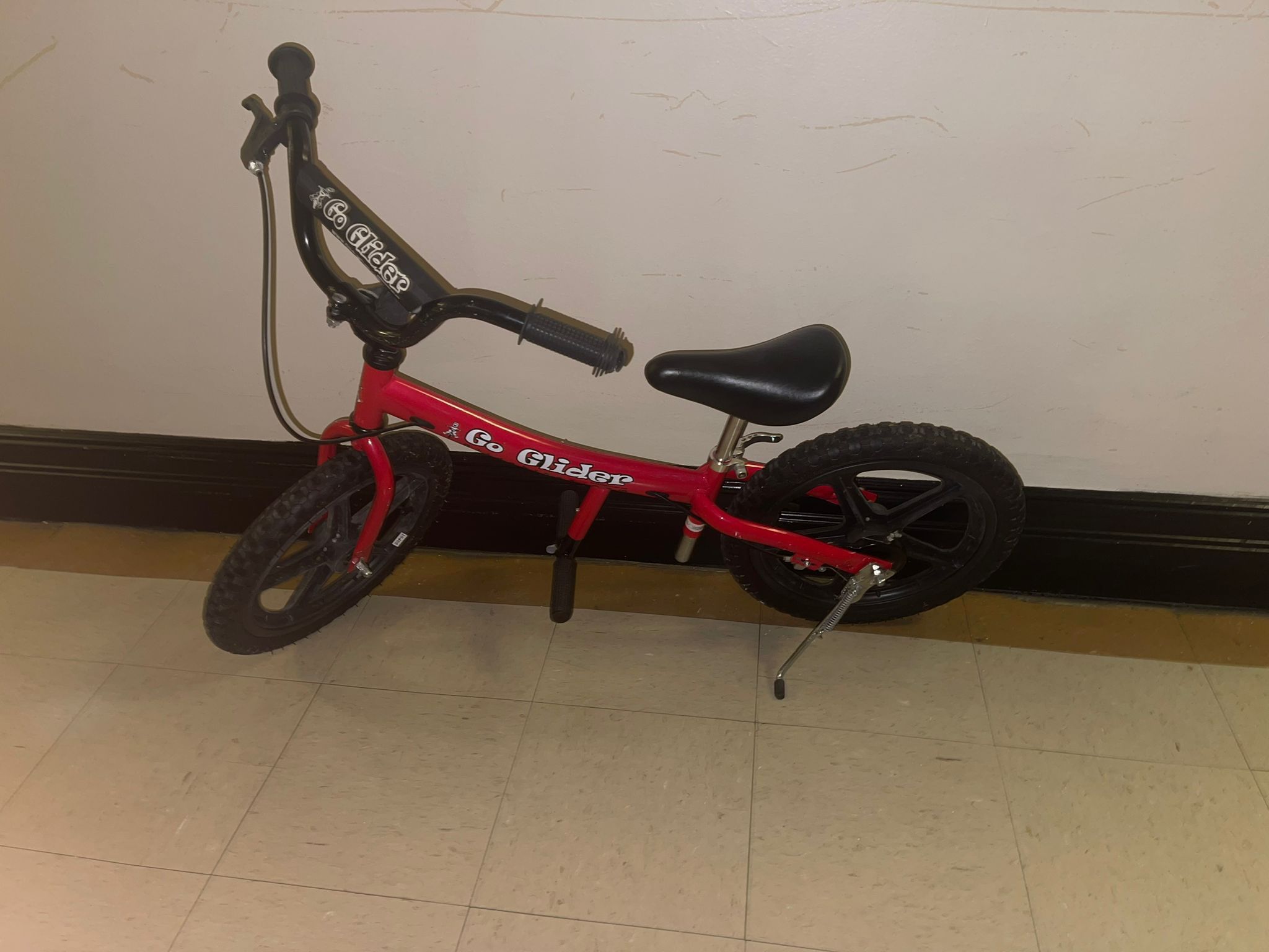 The image shows a Glide Bikes Go Glider Balance Bike, designed for children aged 5 to 10 years old. It is a pedal-less bike that helps children develo
