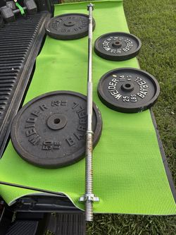 150 Pounds of Weights with Steel Barbell