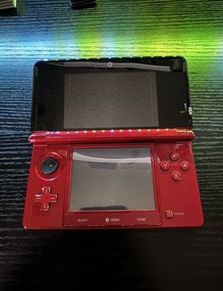 Red Nintendo 3DS With Charger And Charging Cradle