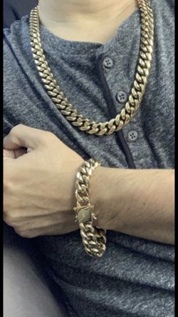 New 14 k yellow gold Cuban link chain and bracelet