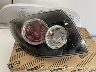 2004 - 2009 Mazda speed 3 hatchback rear driver outer tail light