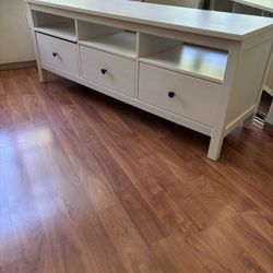 white-stained TV bench with both shelves and drawers. 