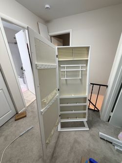 Standing mirror/jewelry cabinet
