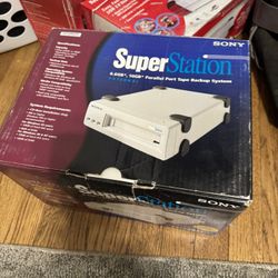 The image shows a Sony SuperStation 6.6GB/10GB External Parallel Port Tape Backup System.