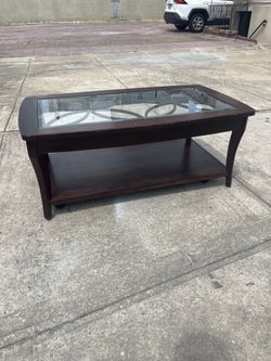 Wood coffee table with glass top with wheels