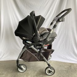 Graco SnugRider Elite car seat frame stroller with a Graco infant car seat attached