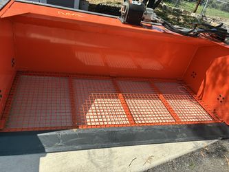 Skid steer top soil vibrating bucket