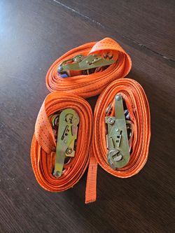 Orange ratchet tie-down straps