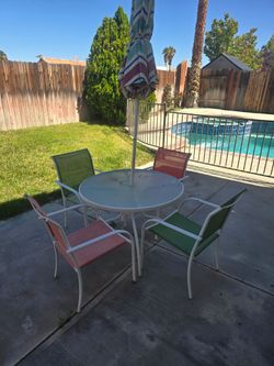 Free outdoor patio set with umbrella. Pool basketball and table