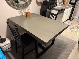 Gray Wood Dining Table with 2 Black Chairs