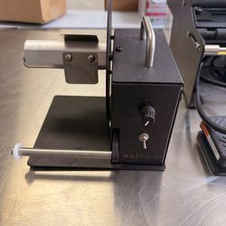 Automatic label rewinder used after printing labels.  Keeps labels organized and ready for application.  Features  • Adjustable speed control • Rewind