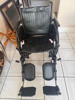 Black Wheelchair with Footrests and Armrests