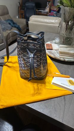 Navy blue leather and canvas crossbody or shoulder carry handbag