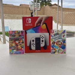 Nintendo Switch Oled with super Mario party and Mario kart deluxe 8 floor model 