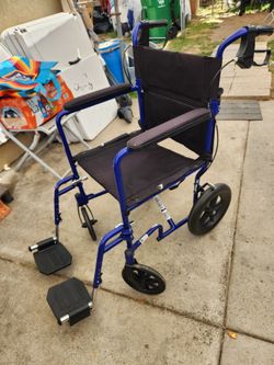 Wheelchair with hand brakes  like new  make and offer