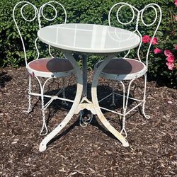 Vintage ice cream parlor table & chairs. Table is very heavy. Wrought iron base has rust/chipped paint. Chairs are discolored see pics! 