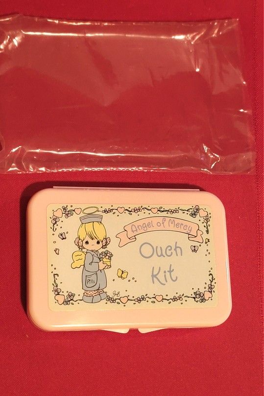 1995 vintage Precious Moments "Ouch Kit" first aid container with Original Contents. 3"×4.5"