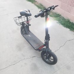 Scooter electric bike with seat for kids is used but work 100% is only for kids won't handle big person only 200lb or less to pull 18mph to 25miles ra