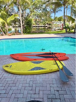 2 lifestyle paddle boards with oars