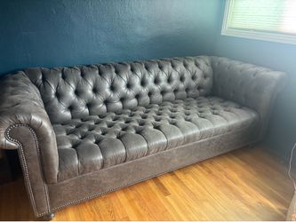 Chesterfield style faux leather sofa