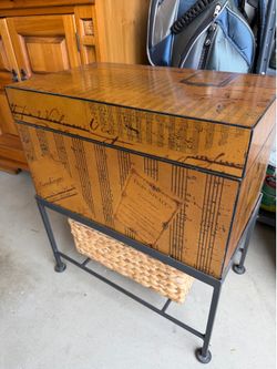 Cabinet for storage with black wrought iron stand