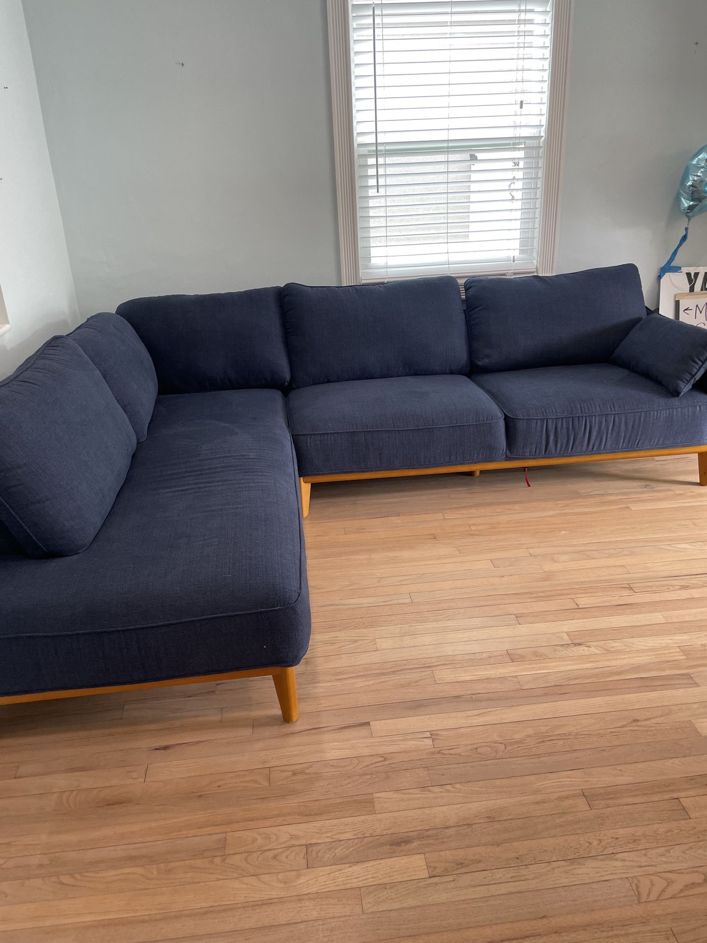 Navy blue cloth mid-century modern sofa. 
