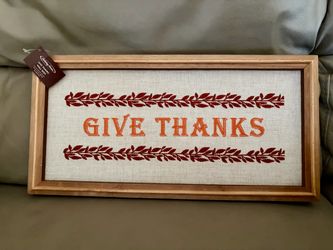 “Give Thanks” Holiday Home wall sign is made of a wooden frame and a burlap-style fabric background