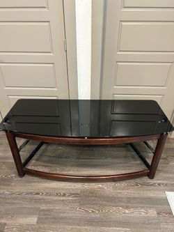 Black glass tv stand.