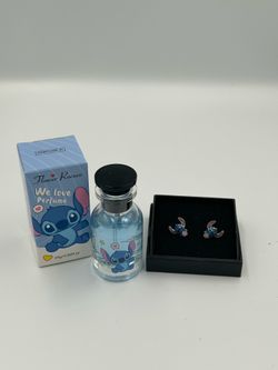 The Cutie 2pc Stitch Bundle includes a Pair of Cute Enamel and Silver Stitch Stud Earrings, and An 26ml bottle of Flower Rococo Stitch perfume  (2) Av