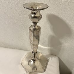 silver plated candle holder, very heavy and beautiful.height 15 inches