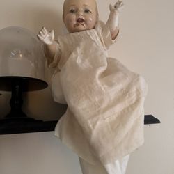 Creepy haunted antique baby