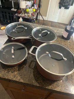 Great deal set of 4  great condition Gotham metal skillets with lids