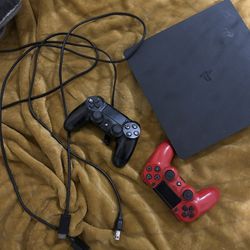 PS4 Slim console with 2 controllers and cables