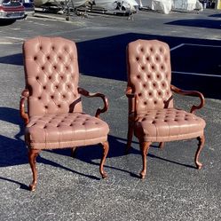  Pair of button tufted leather chairs