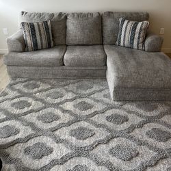 Ashley Sofa Chaiser Couch And Area Rugs 