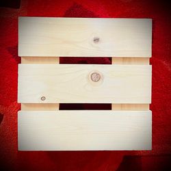 NEW WOODEN PLANT STAND ON WHEELS. SIZE: 12" X 12".