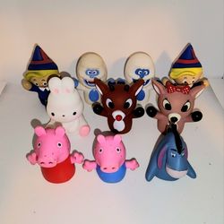 finger puppets from Rudolph the red nose reindeer, Peppa Pig, and eeyore 