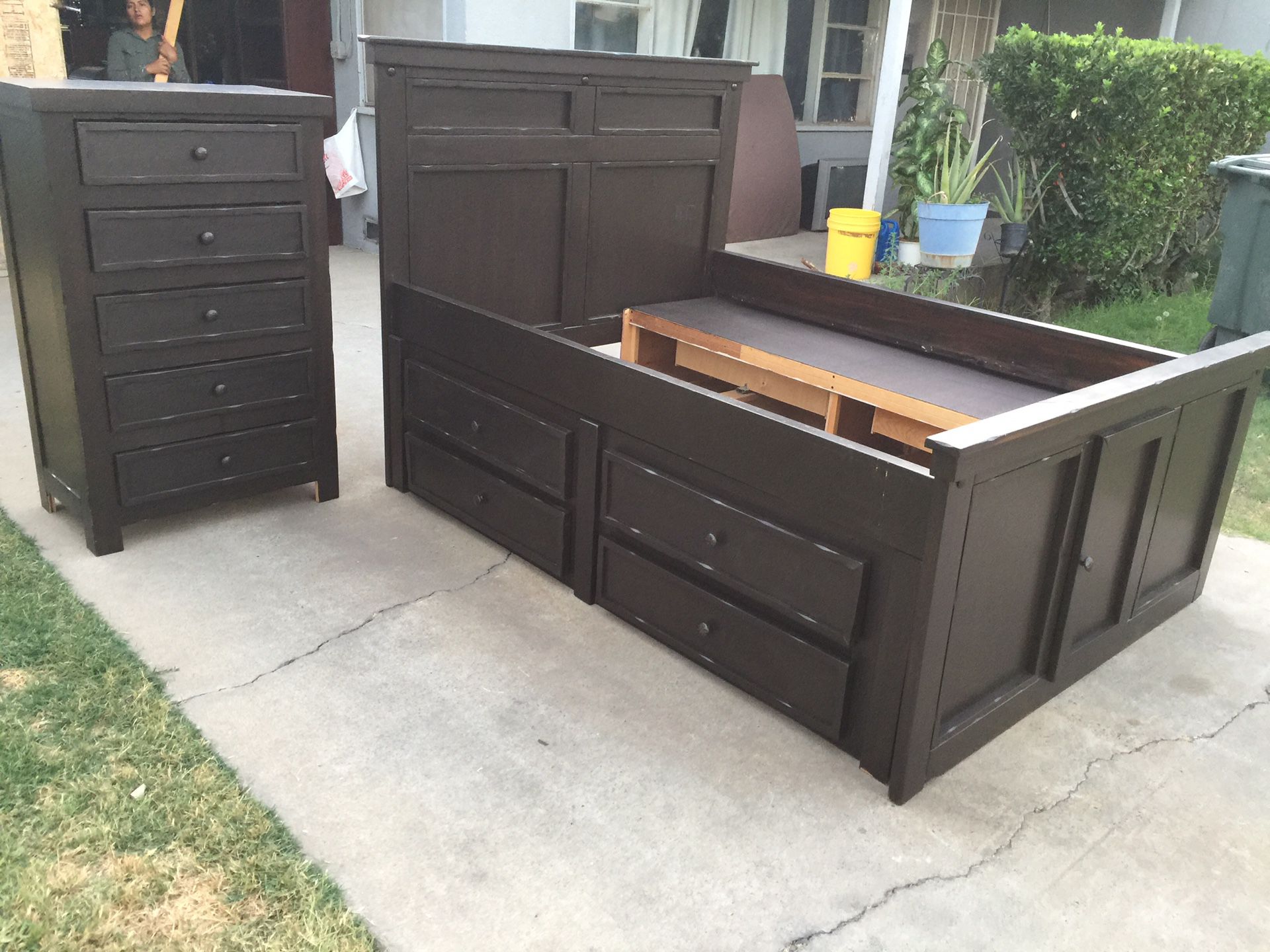 Full bed frame with double storage and eight drawers and one tall dresser with five drawers all drawers open fine.