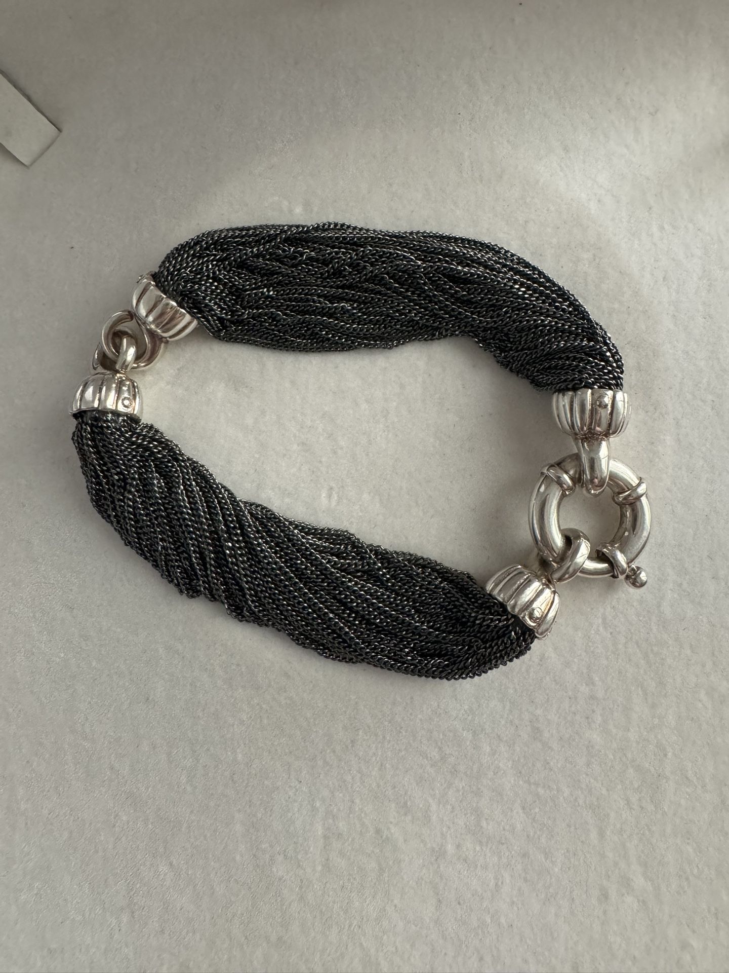 Authentic Tiffany & Co. Vintage Multistarnd Link 925 Silver Braided Strand Bracelet RARE Length: approx 7.5” Width: 0.5" Metal Type: Sterling Silver