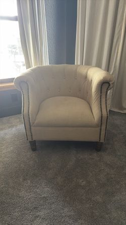Two Beige Chairs With Wood Legs