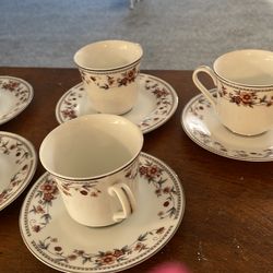 China saucers and cups with dessert bowls
