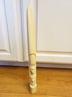 16" resin reproduction of a carved walrus tusk