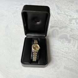 GENEVA Ladies Two Toned Diamond Quartz Watch. Perfect accessory for any woman. With a beautiful gold and silver band color, this watch is both casual 